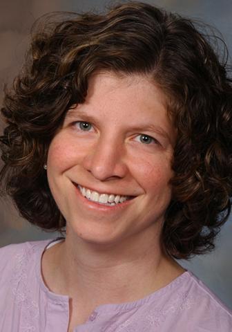 A headshot of Dr. Torri Metz smiling at the camera